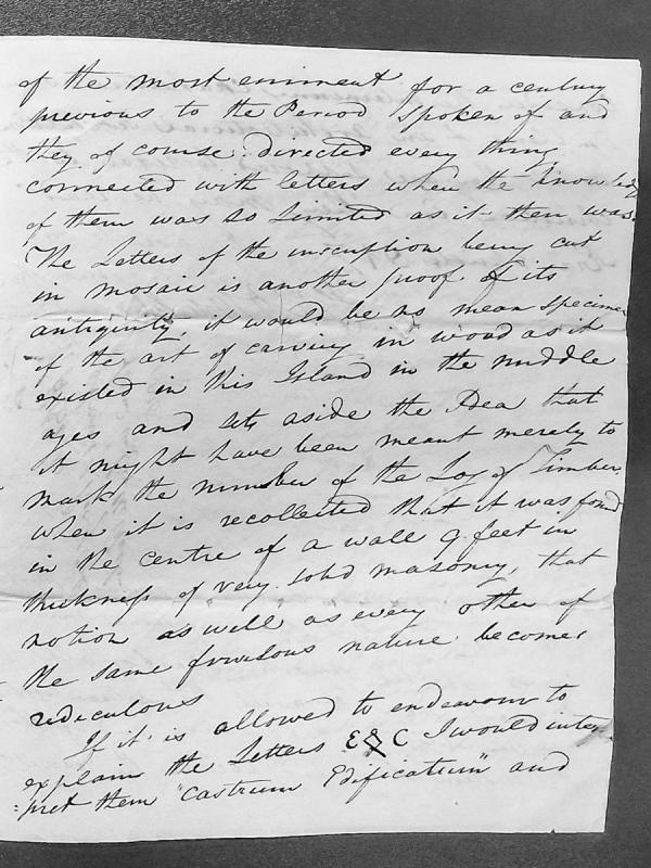 Discussion of inscribed letters found in medieval masonry, possibly Latin abbreviation